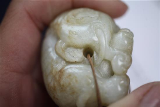 A Chinese pale celadon and russet jade figure of an elephant, 18th century, length 4.6cm